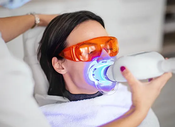 Patient undergoing teeth whitening procedure